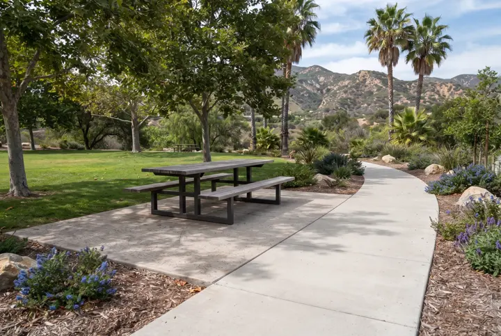 Accessible picnic table on a firm paved pad at a park
