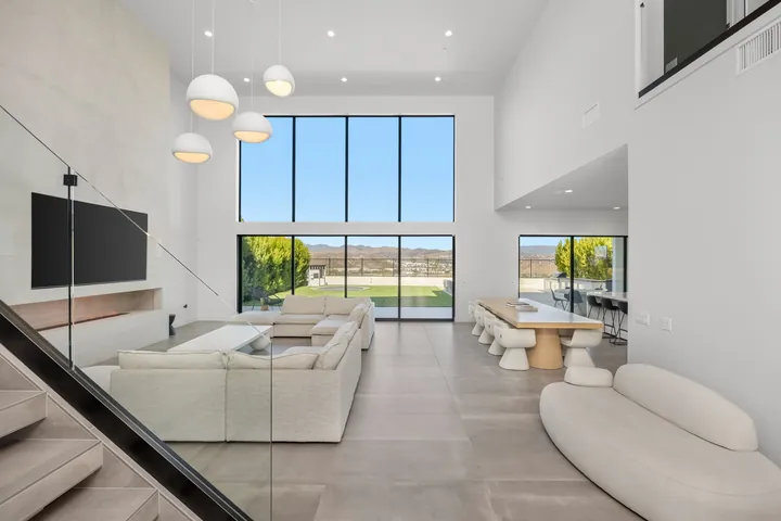 Living room with a glass stair railing and valley views, interior design and renovation in Santa Clarita, CA, photo 6