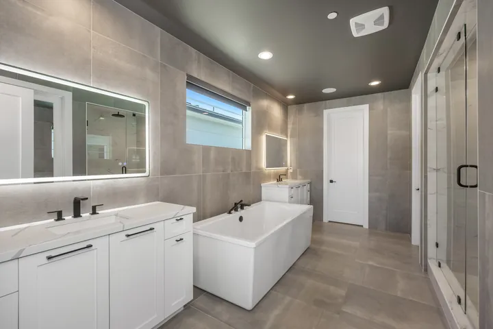 Primary bathroom with a freestanding tub, double vanity and backlit mirror, bathroom renovation in Santa Clarita, CA, photo 18