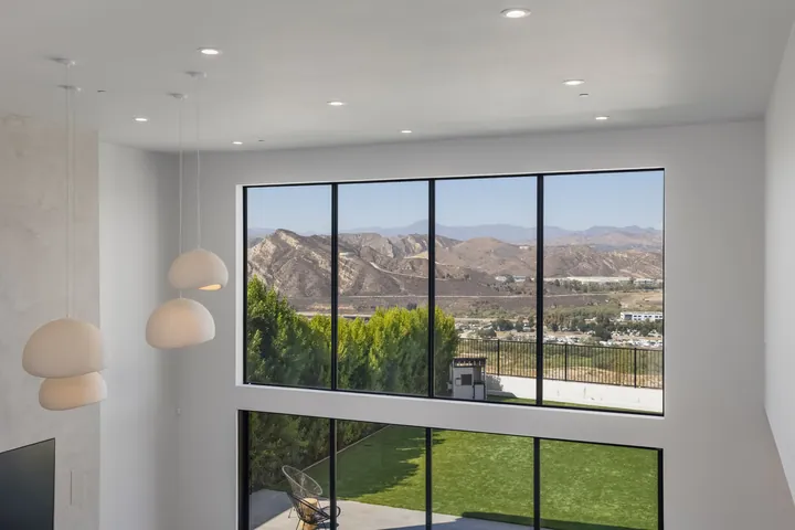 Stair landing with a large picture window framing mountain views, interior design in Santa Clarita, CA, photo 25