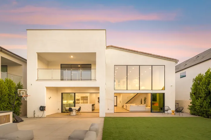 Modern white home at dusk with glowing windows, Santa Clarita, CA, interior renovation by MSH Development, photo 34