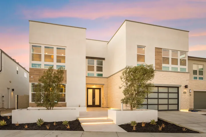 Modern white two-story home at twilight with stone accents and warm lighting, Santa Clarita, CA, interior renovation by MSH Development, photo 33